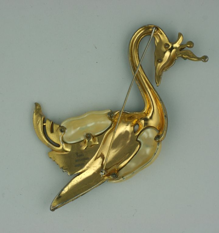 This oversized swan brooch is considered by most to be one of the most important iconic pieces of American Costume jewelry ever made by Trifari in the 1930s. Designed by David Mir for this renown American jewelry house. 
The scale and design of