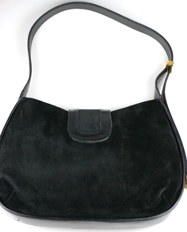 Attractice mixed suede and calf hobo with gilt ball clasp. Adjustable calf strap with 