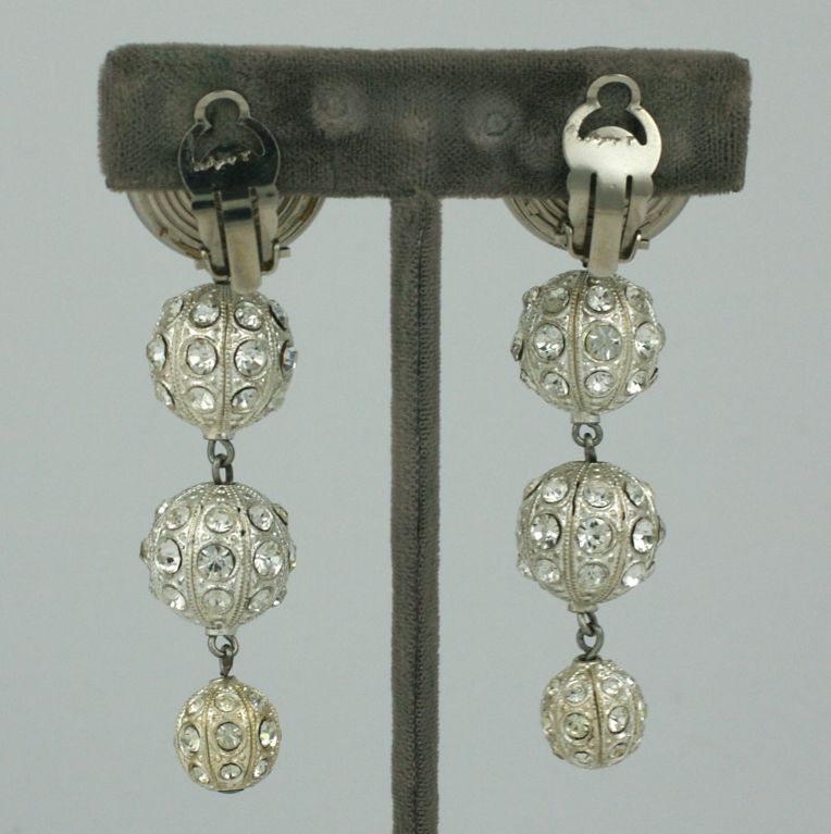 Dramatic french long earrings of silver gilt spheres set with crystal stones. Circa 1960s<br />
Excellent condition