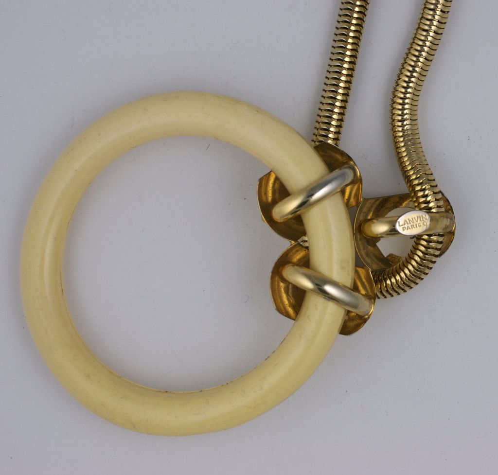 Timeless large faux ivory hoop pendant on gilt snakechain by Lanvin,Paris 1970s. <br />
Excellent condition