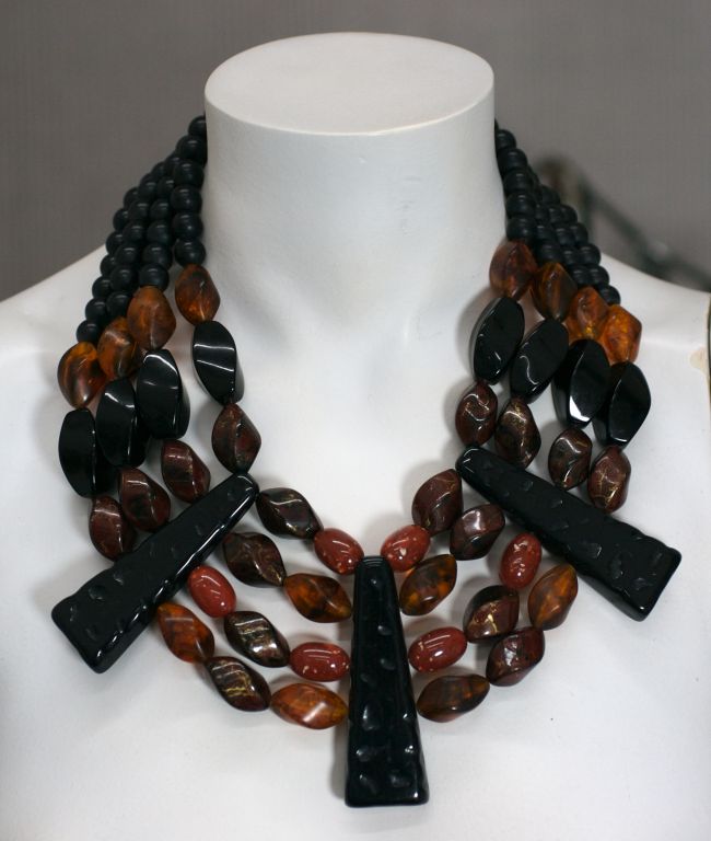 Unusual and striking collar of marbleized resin/plastic beads with carved black bakelite stations.<br />
Excellent condition, 1980s.