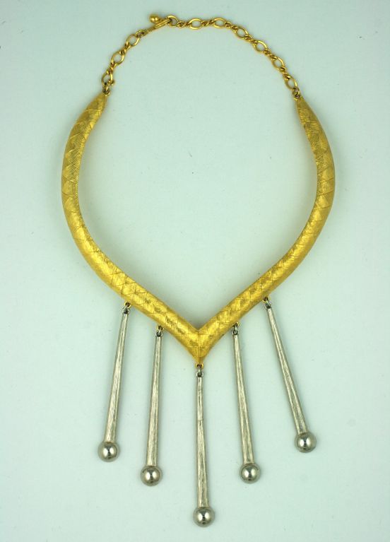 Attractive gilt collar from the 1970s with long silver pendants. Closes with chain in back. Small size. Excellent condition.