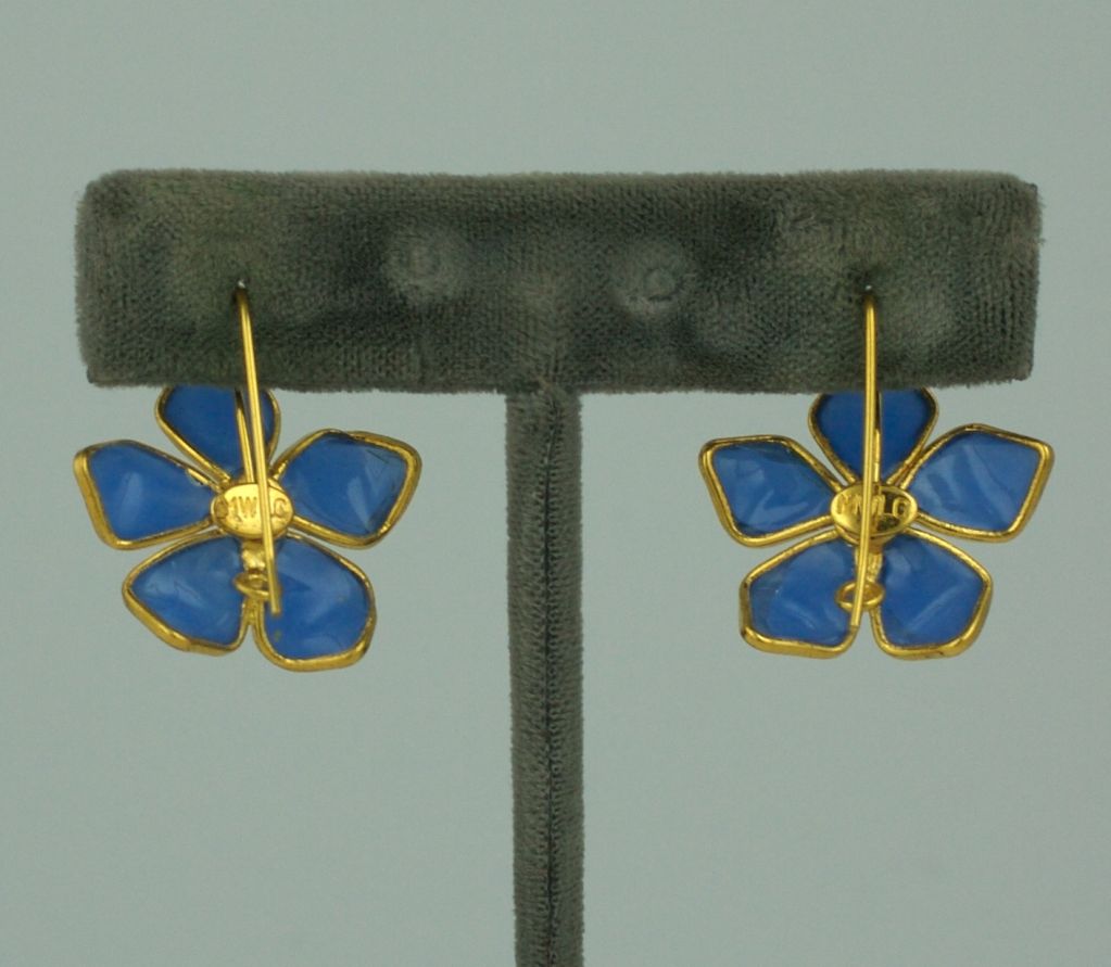 Description: Handmade opaline blue poured glass flower earrings from the 