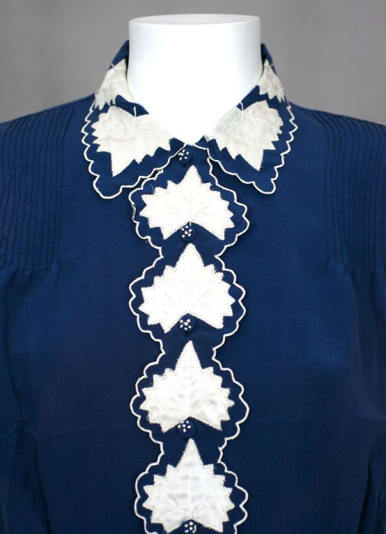 Charming blouse with massive amounts of hand applique and embroidery work. Ivory silk satin 