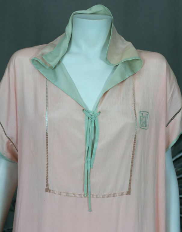Shift style 1920s silk lingerie dress from the 1920s. Pale pink feather weight silk backed in celadon silk at sailor collar,sleeves and hem. Lace up front with delicate faggoted openwork detailing throughout. Great belted for easy summer