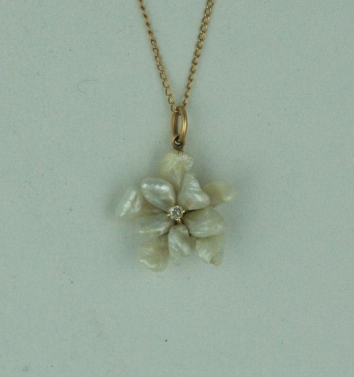 Charming natural Missisippi pearl flowerbud pendant with diamond center from the early 1900s. Set in 14k with 14K fine chain.<br />
5/8