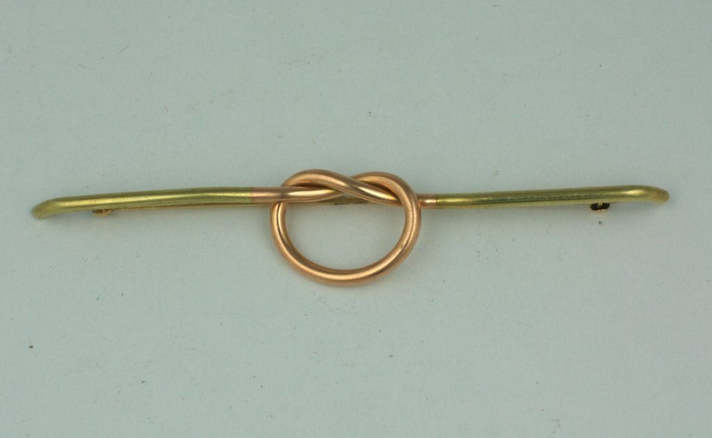 Oversized knot brooch in 2 toned 14K gold. Rose gold and yellow gold are used to make this simple but striking brooch. American, 1930s. Very substantial in weight. 
4