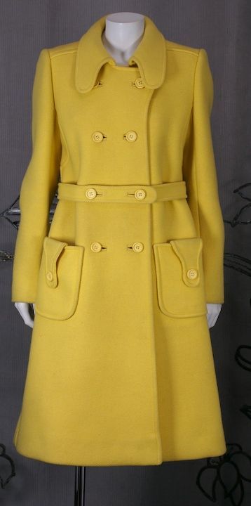 Chrome wool twill coat by Courreges,Paris. Electric yellow color with great tab detailing and attached self belt. Immaculate tailoring with unusual seaming throughout.<br />
Size 6-8. Size A/France. Retailed by Bonwit Teller.<br />
Excellent