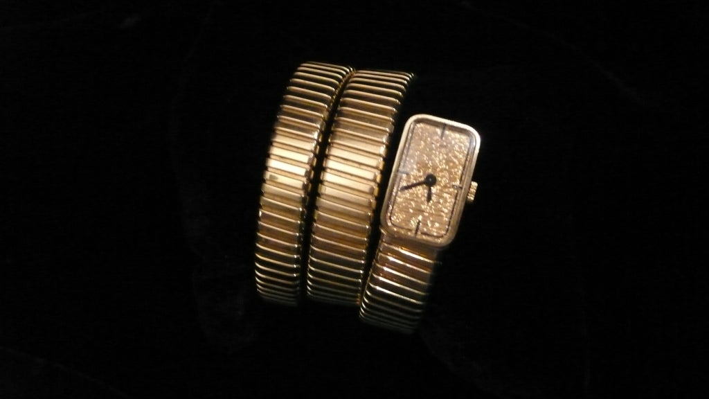 Bulgari lady's 18k yellow gold snake-form Tubogas bracelet watch