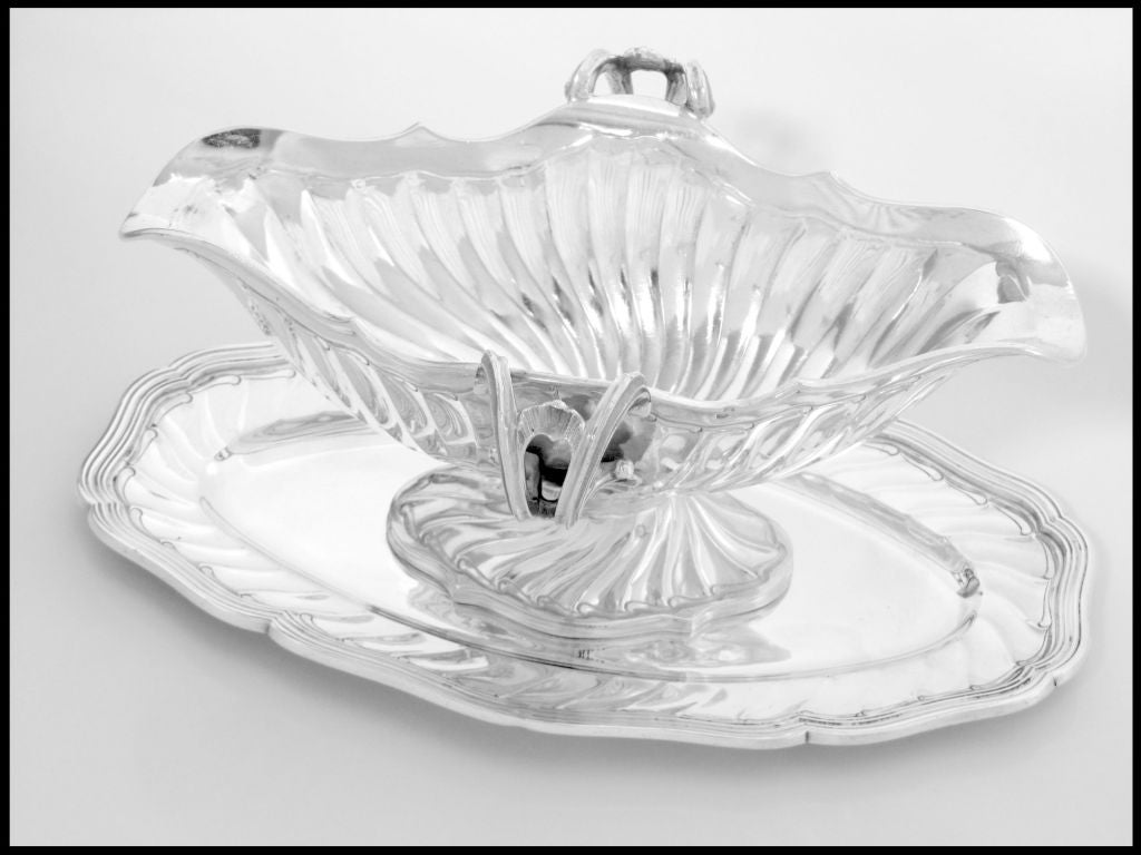 TOP Quality Antique French Sterling Silver Gravy/Sauce Boat with Tray Rococo.

A gravy boat of truly exceptional quality, for the richness of decoration, form, level of finesse and sophistication. A example of the very developed Rococo style with