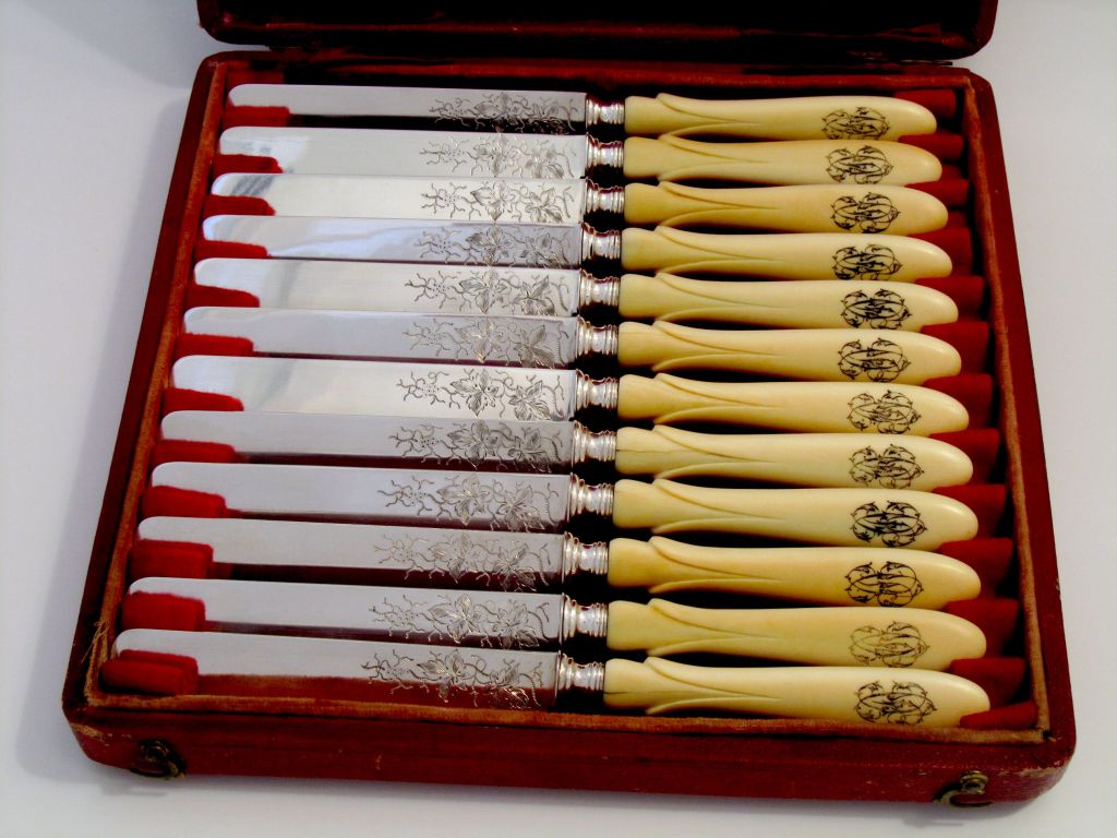 Antique French Sterling Silver Blades engraved with vines Knife Set 12 pc w/box 

Hallmarks :
Head of Minerve 2 st titre on the blades for 800/1000 French Sterling Silver guarantee. 

Prestigious silversmith :
Gustave Leroy
68 rue