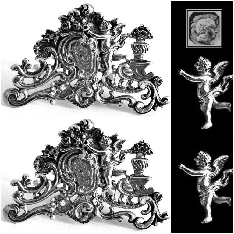 Fabulous Pair French All Sterling Silver Menu/Place Holders Cherubs 

A rare pair of menu or place holders of truly exceptional quality, for the richness of Rococo pattern.

Head of Minerve 1 st titre for 950/1000 French Sterling Silver