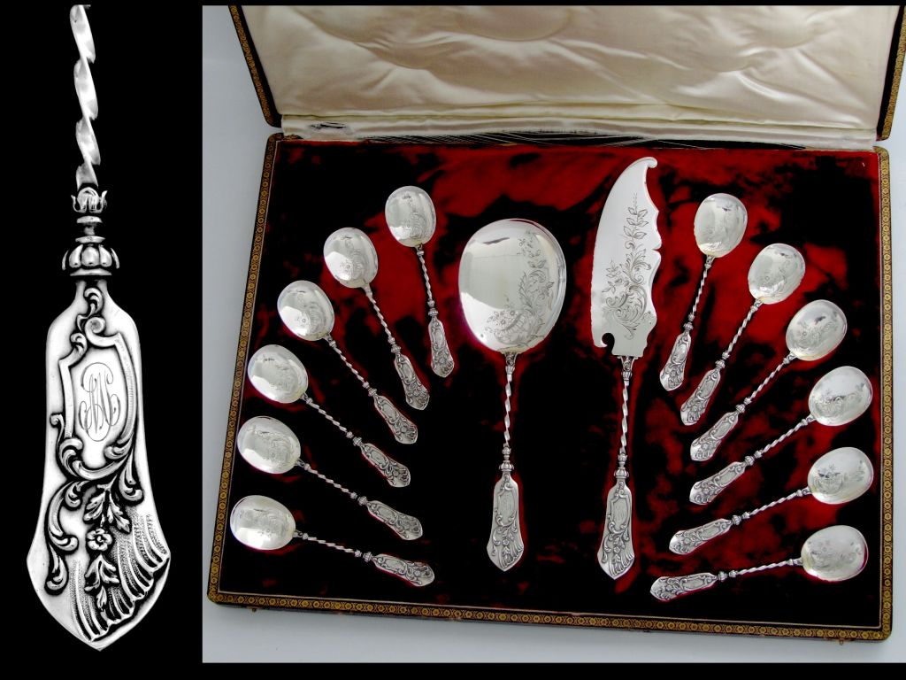 Top Quality French All Sterling Silver Ice Cream Set 14 pc original box Flowers

The set includes two servers and twelve ice cream spoons. Floral motifs on the bowls. The handles have foliage and flowers decoration. Parts with cabled column stems
