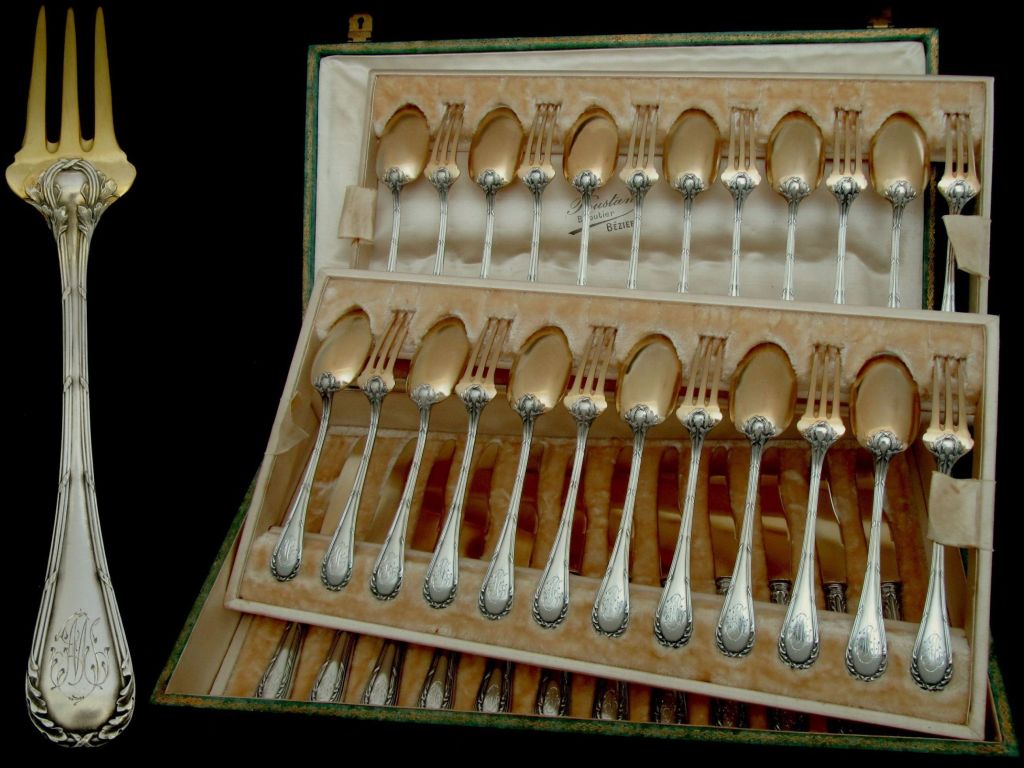DEBAIN French Sterling Silver Vermeil Dessert/Entremet Flatware Set 36 pc with original box.

The design and workmanship of this flatware is exceptional. The handles have Louis XVI style decoration of crossed ribbons and foliage. Multi-coloured