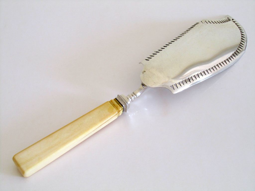Large & rare Napoleon III period,  French Sterling Silver Fish Knife or Serving implement with carved and pierced decoration.

Hallmarks :
For Paris 1819-1838, 
