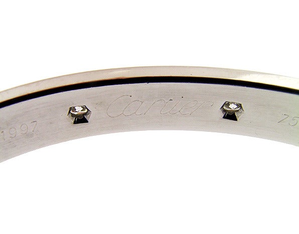 A Cartier 10 diamond white gold love bracelet with screw driver in original box. Made circa 1997 identification number F40046. The bracelet is size 16 and clearly stamped Cartier and 750.