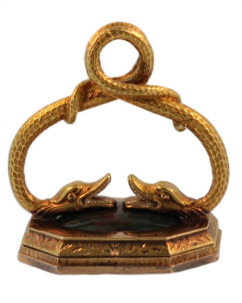 This exceptional fob tests 18kt gold. It contains two bloodstone plaques, one on each side of the opened frame. The fob is French, and when opened bears the inscription 