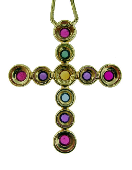 Classic Paloma Picasso cross pendant with semi precious round cabochon gem stones in 18KT yellow gold with original chain.

Tiffany & Co. SKU# 190.46.11992331
Tiffany & Co. Report# 13354/T4578/1