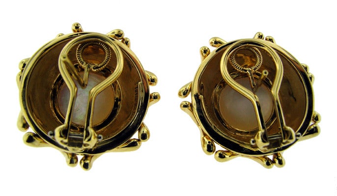 A pair of 18KT yellow gold and mabe pearl earrings.

Tiffany & Co. SKU# 188.15.1370873
Tiffany & Co. Report# 15906/T5548