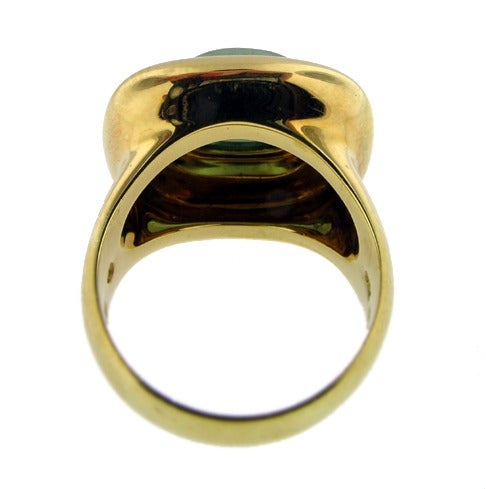 Tiffany & Co. Paloma Picasso ring featuring a green tourmaline set in 18KT yellow gold. Size 6.5.