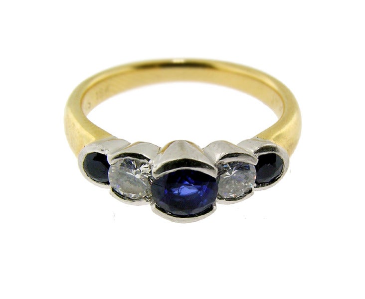 A Birks ring with gem stones set in platinum with yellow gold band. Diamonds .28cts  E-F and SI1 quality. Sapphires .60 
Measures size 5.75
