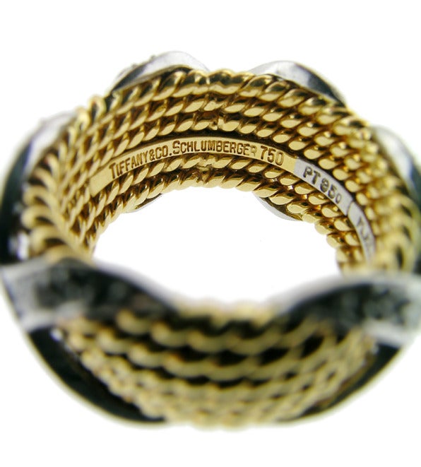 A classic Jean Schlumberger design ring, 6 rope bands, 18KT yellow gold. The E-F colour and VS clarity diamonds are bead set in platinum. The ring is small and measures size 4.