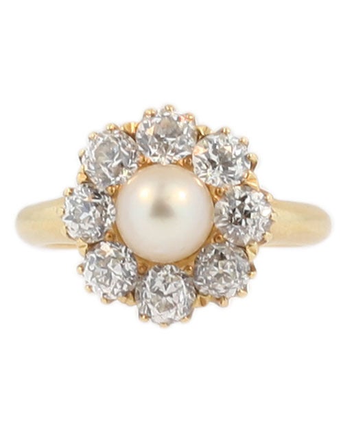 A natural pearl and diamond ring made by Ryrie Brothers circa 1910. The pearl has very good luster and is surrounded by 2.8 cts of old European cut diamonds.  The ring measures size 8.