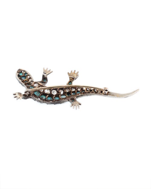 This is a charming silver diamond and turquoise brooch with fine detailing. 
Total Diamond weight 2.60 ct Old European cut.
