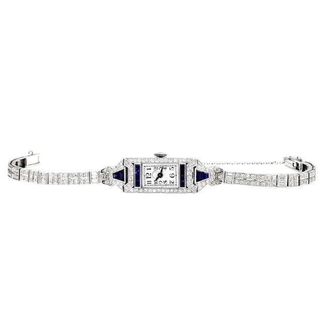 An extremely rare and timeless Art Deco Tiffany & Co. lady's diamond wristwatch. This elegant and classic watch is set with round, single-cut diamonds, princess-cut and trapezoid-shape sapphires in a platinum case with a manual-wind movement.