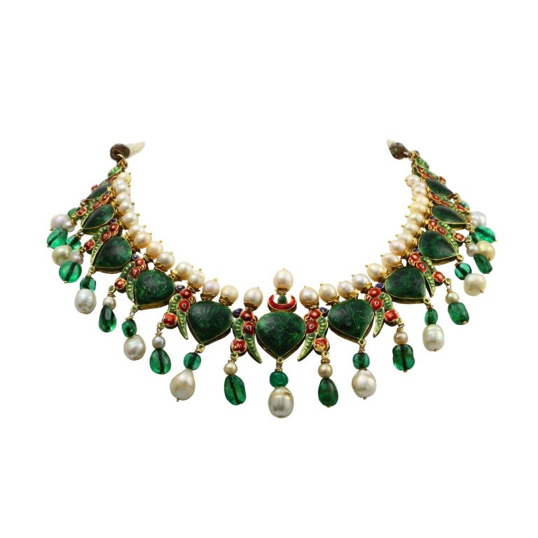 An impressive, vintage, and royal Indian enamel necklace with natural saltwater pearls, old-mine Colombian emerald beads, and large rose cut diamonds. The estimate weight of the diamonds is forty-five to fifty carats. The necklace is presumed to be