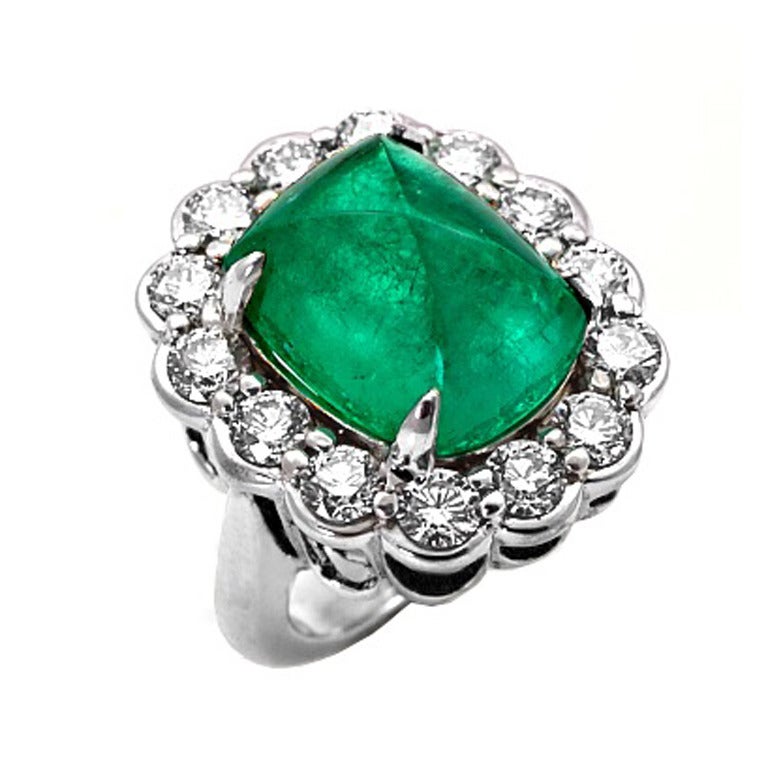 A Colombian Emerald Sugarloaf Cabochon and Diamond Ring
