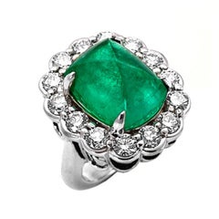 A Colombian Emerald Sugarloaf Cabochon and Diamond Ring