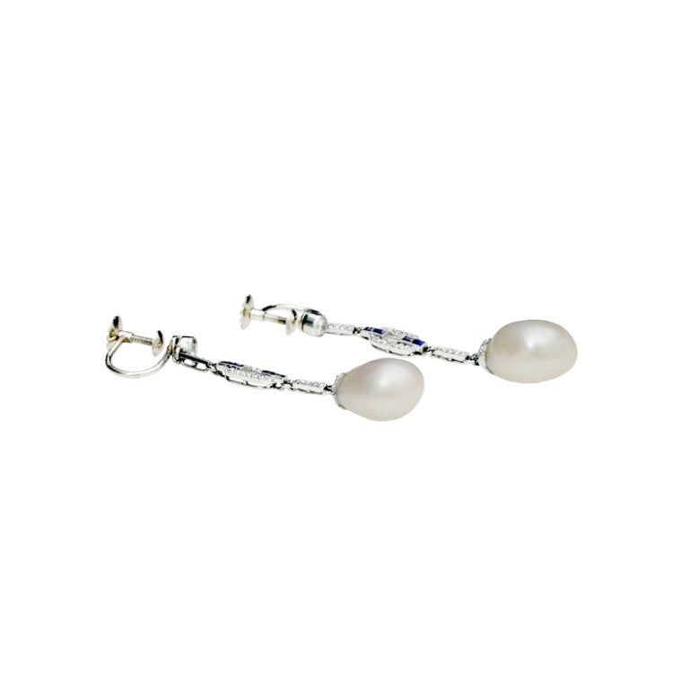A pair of art deco Natural Saltwater Pearl Earrings with antique old-mine and rose-cut diamonds with sapphire baguettes set in Platinum. Accompanies a GIA Report indicating Natural, Saltwater. The weight of the pearls are 7.93 carat, measuring 13.95