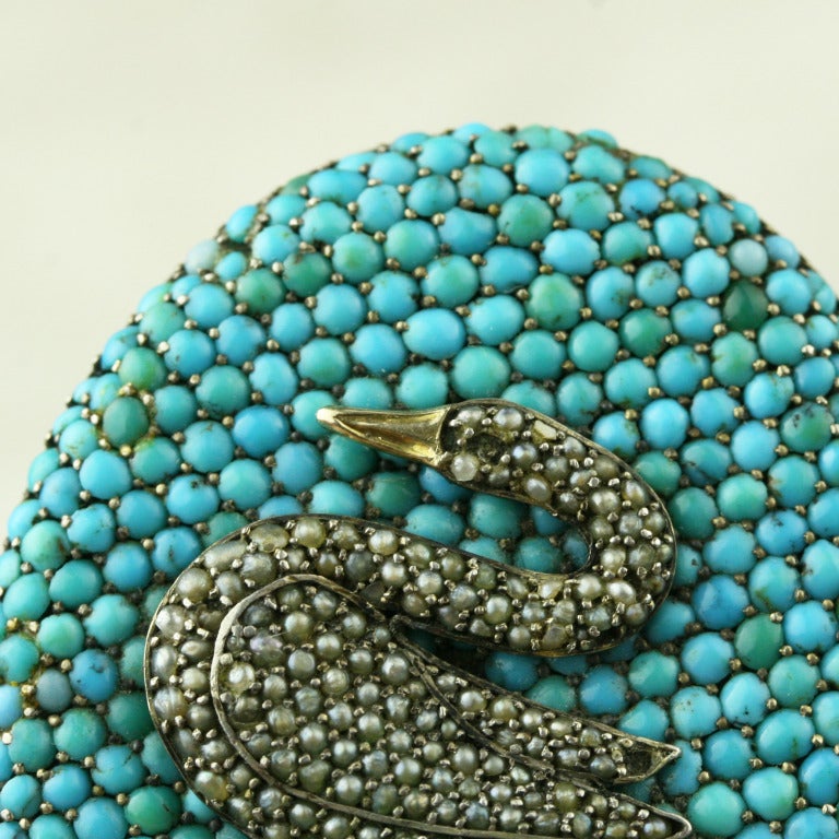 - Victorian Turquoise and Pearl Swan Brooch
- c. 1880-1900
- Persian turquoise, uncultured split seed pearls, sterling silver, at least 10k gold

An absolutely stunning find, this arresting piece is simply wonderful. A gold and sterling silver