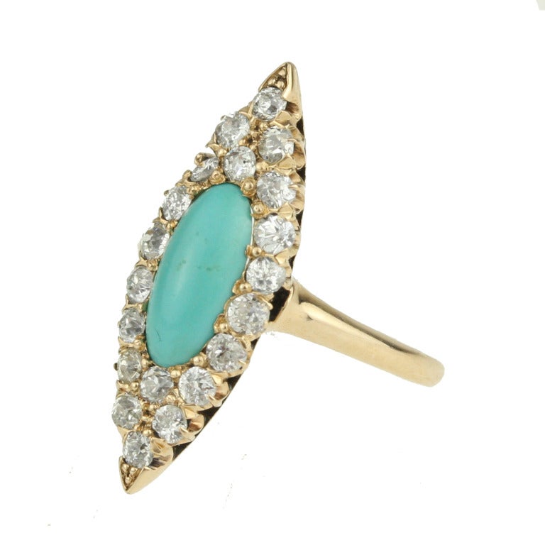 - Victorian Turquoise and Diamond Navette Ring
- c. 1880-1900
- 14k rose gold, Persian turquoise, 20 old mine-cut diamonds with a total weight of approximately .80 carats

A strikingly lovely find, this megawatt Victorian ring features a