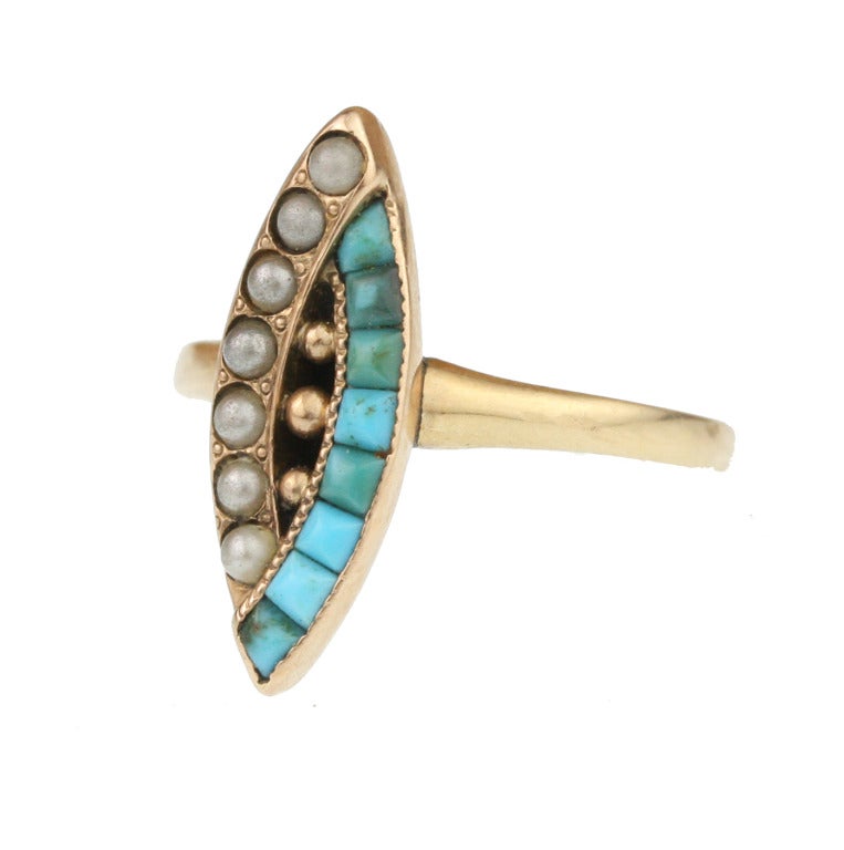 - Victorian Turquoise and Seed Pearl Navette Ring
- c. 1880-1900
- 14k rose gold, Persian turquoise, uncultured seed pearls

A sculptural and pleasing find, this 14k rose gold ring features overlapping bands of tapered tapered pyramid-cut