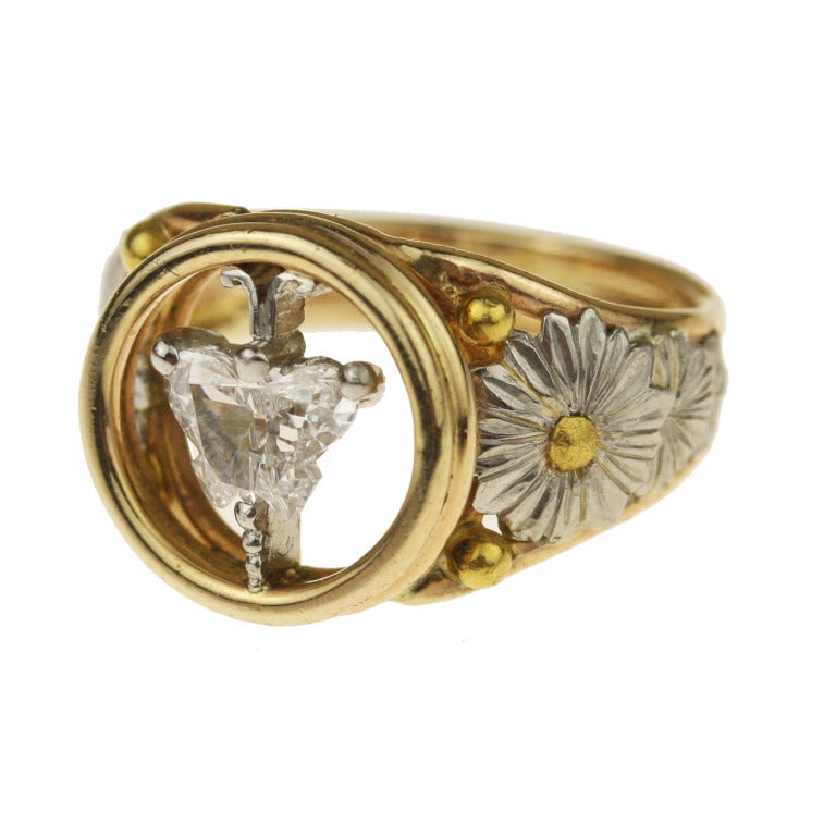 - Daisy and Butterfly Ring
- Handmade by master goldsmith, William L. Howard
- 18k yellow gold shank, platinum head and flowers, 22k yellow gold stamen details, .57 carat laser-cut diamond butterfly

Fully hand-made and wonderfully