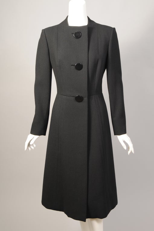 Simple and elegant this light weight black wool coat from Pauline Trigere can be dressed up with a pashmina or silk scarf. You can change that to a wool scarf or a cashmere throw for a more warmth during socially distant meetings with friends. The