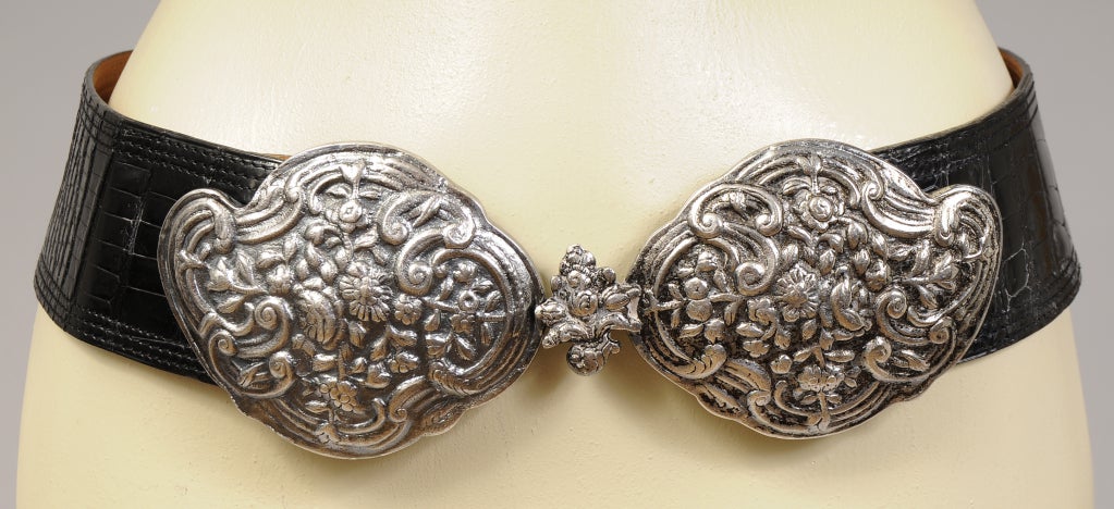 Hermes has created a striking belt using navy blue crocodile skin and an elaborate floral belt buckle with a silver finish. The belt is marked Hermes, Made in France and it is in excellent condition.

Measurements;
Length adjusts to 31