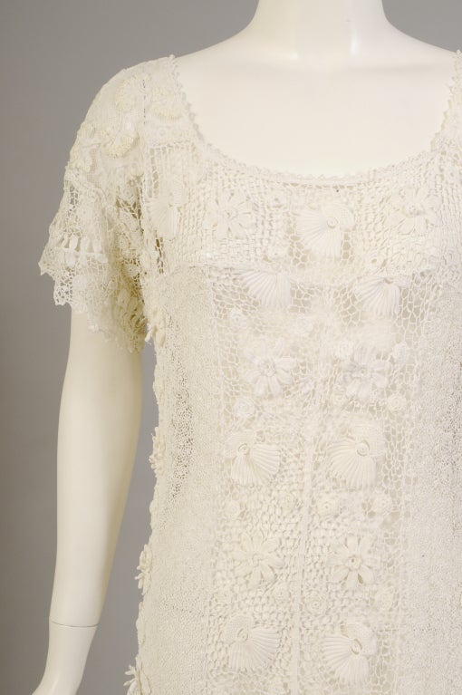 A stunning combination of hand made Irish lace, mixed lace and embroidery are used to create this hand made dress from the 1920's. Truly a dress that can be worn and enjoyed on more than one occasion, unlike so many of the more formal Victorian