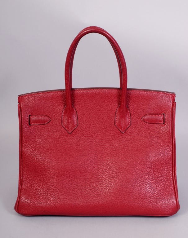 My client purchased this gorgeous Birkin in 2004 at the Hermes sample sale and it is marked with an S in a circle. There is absolutely no doubt that the bag is original. She carried it a few times in the past decade, so the condition is like new. It