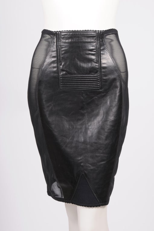 This skirt from Jean Paul Gaultier is just amazing! It is made from buttery soft black leather with panels of sheer black lycra. The design mimics the fit of a 1950's girdle and so does the fit. The front of the skirt has a channel quilted detail,