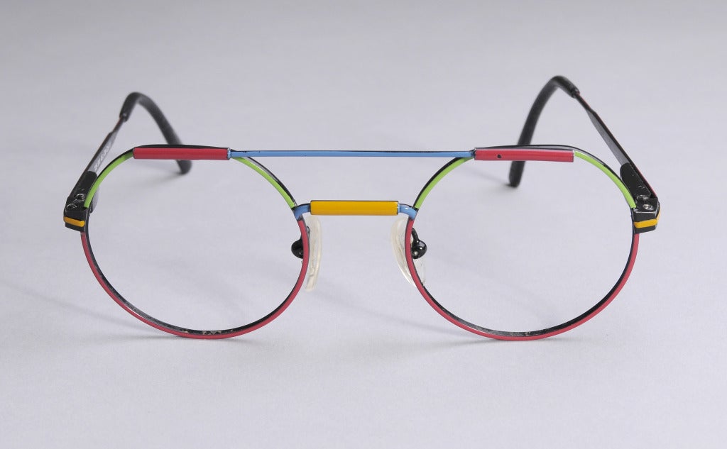 Bold primary colors and an appealing shape make these French eyeglasses a conversation starter. There is one tiny spot on the red bar above the left eye, otherwise they are in great condition.

Measurements;
Top Bar 3.5