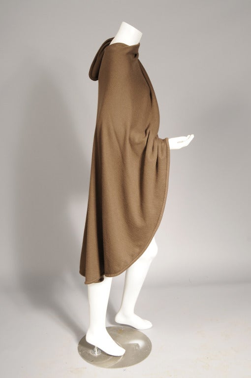 Halston used a double layer of cashmere for this super soft wrap style cape. It was retailed by Bergdorf Goodman and it is in excellent condition. One size fits all.

Measurements;
Length at center back 40
