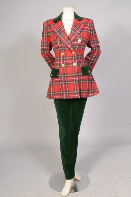 A cheerful red wool plaid jacket is trimmed with bottle green velvet on the collar, cuffs and pockets. A matching green velvet  skirt and pants complete the ensemble. All three pieces are in excellent condition.

Measurements;
Jacket 
Shoulders