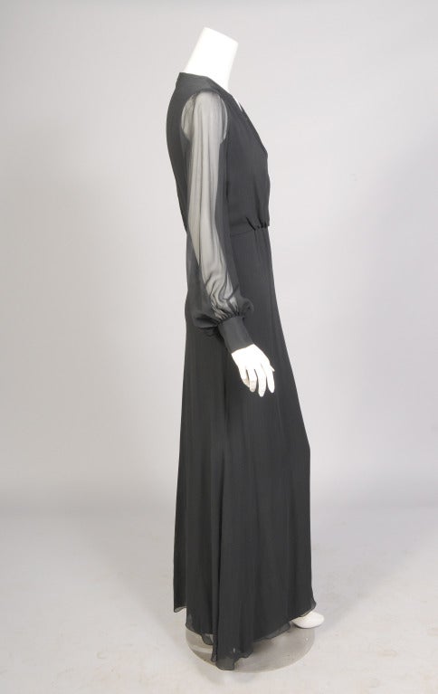 A classic black silk chiffon evening dress from Coty Award winner and couture quality designer John Anthony. This 1970's dress is a perfect backdrop for your best jewels. It comes with a detachable white collar and cuffs. The dress is in excellent