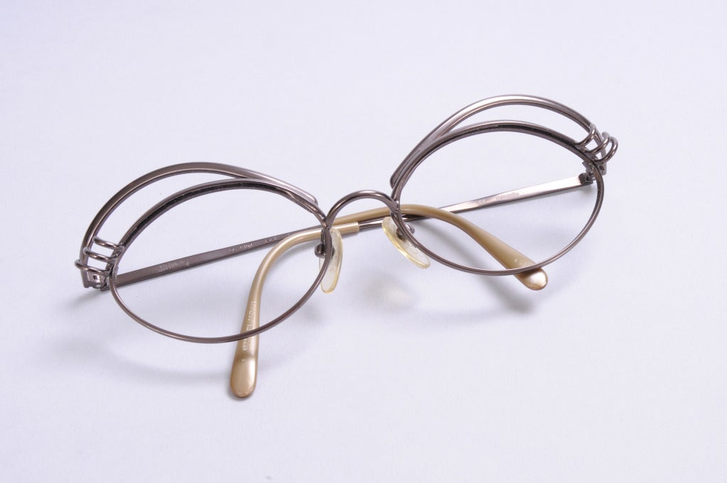 Bronze colored metal frames from JPG have amusing curled eyelashes and raised brows lending a sense of whimsy to the look. They are ready for your choice of lenses and they are in excellent condition.

Measurements;
Length 5 1/2