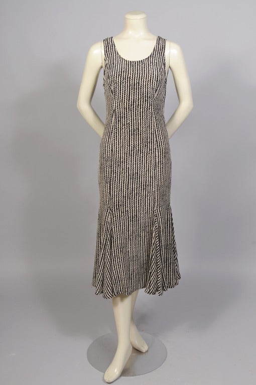 A graphic black and white print and a flirty skirt enliven the simple lines of this silk dress from Fendi. It is marked a size 4 and it is in excellent condition.

Measurements;
Bust 34