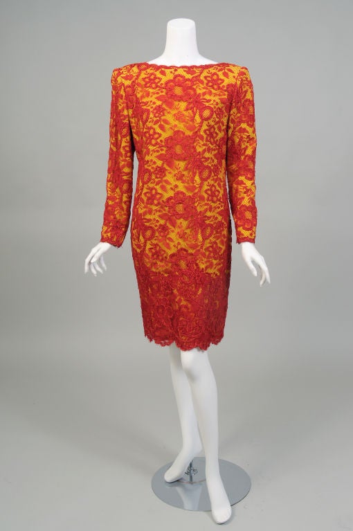This dress has it all; the fabulous quality James Galanos is famous for, amazing color and fabrics, and a terrific co-ordinating cotton jacket.
The dress is cut in a simple style, allowing the spectacular red lace to take the spotlight. The floral