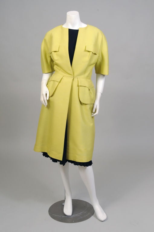 This is quite a modern and chic outfit from Arnold Scaasi, designed in the 1950's and retailed by Nan Duskin in Philadelphia.  <br />
Chartreuse silk is used for the very contemporary looking short sleeved coat.  There are four fabulous looking